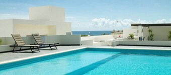 Modern Condo 2BR with Rooftop Pool Ocean Views  10 Min Walk to Medano Beach and