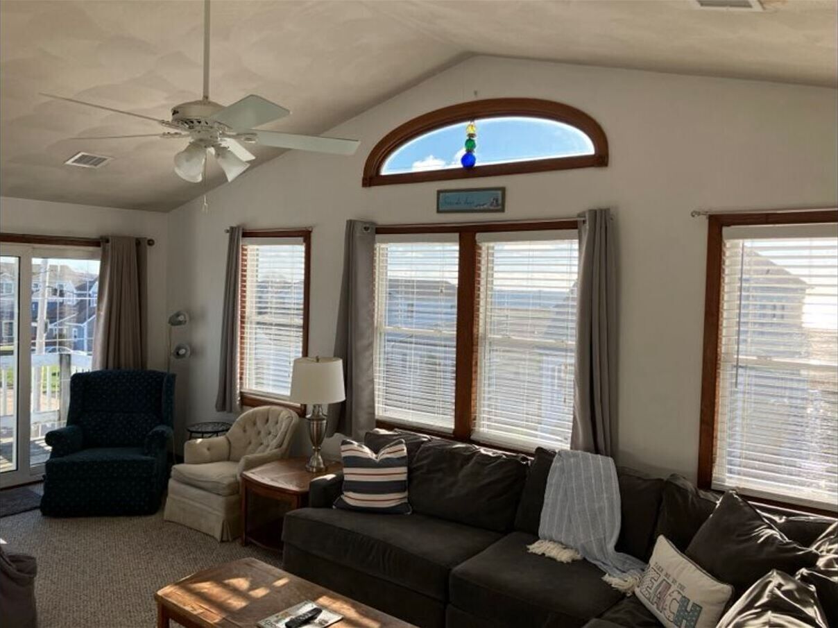 2nd level living room - ocean views; 49" TV with cable; access to deck