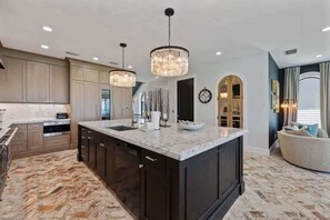 Fridge, microwave, oven, stovetop - Serendipity Deux: Luxury Beachfront Retreat + Elevator + Complimentary Golf Cart (Anna Maria)