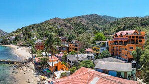 A coastal town with boats on the water, a beach, and colorful buildings. - Penthouse in Yelapa, Brand New and Luxurious Casa, Sleeps 8 very comfortably (Yelapa)