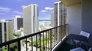 A balcony with a view of tall buildings and the ocean. - Diamond Head and Ocean View Waikiki Sunset! (WS06) (Honolulu)