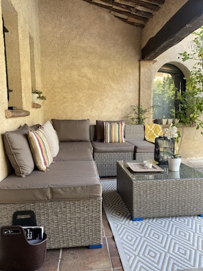 Outdoor seating area facing pool