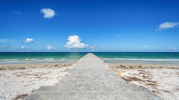 On the beach, sun loungers, beach towels