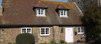 Casa de Annie.  Una cabaña bonita del estilo de la caja del chocolate con las porciones de carácter.