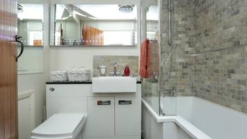 Combined shower/bathtub, hair dryer, towels, soap