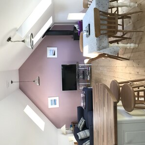 Flat-screen TV, DVD player, books