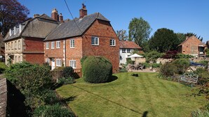 A large brick house with a well-maintained lawn and garden. - Nr Devizes, Marlborough & Bath, , walled garden (Seend)