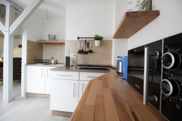 Fridge, microwave, stovetop, coffee/tea maker