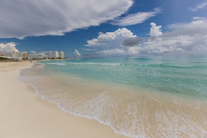 On the beach, sun-loungers, beach towels