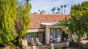 A house with a patio, outdoor furniture, and a view of palm trees. - 
FUN IN SUN, GOLF&TEN.FEB-MARCH, PALM DESERT, PALM VALLEY CC. 55-Day Minimum
   (Palm Desert)
