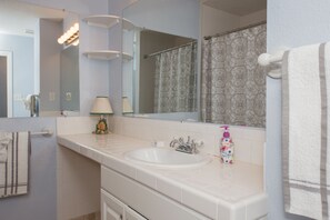 Combined shower/bathtub, hair dryer, towels, soap