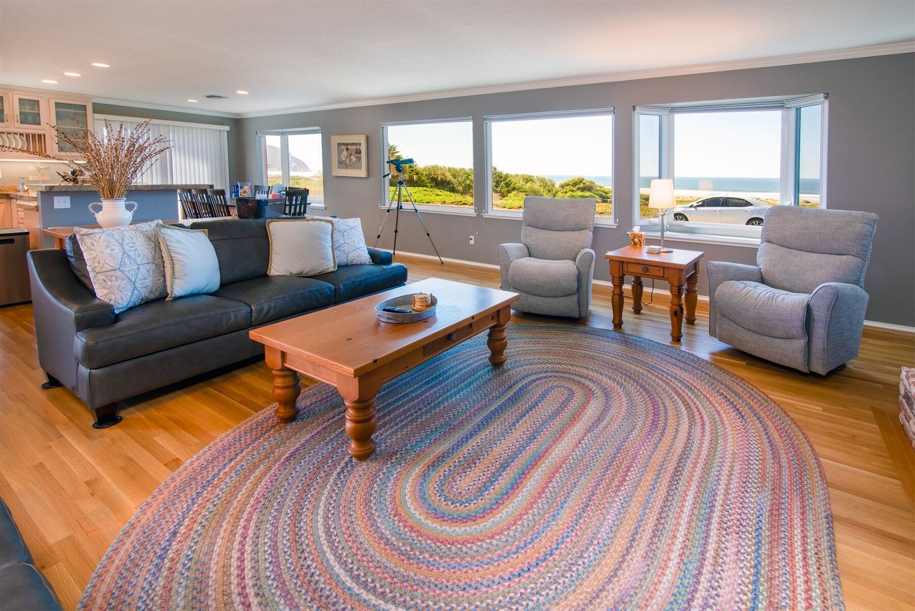 The living room features plenty of comfy seating for all