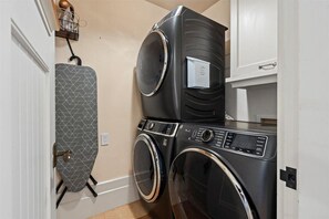 Modern laundry room with stacked washer and dryer for convenience - Luxury, Beachfront- Ka'anapali Beach, Pool & Hot Tub! (Lahaina)