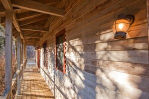 Enjoy a peaceful retreat in this cozy cabin with a covered porch and scenic views.