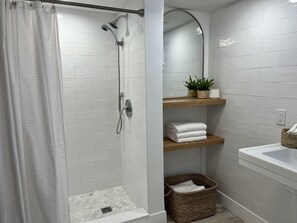 Bathtub, hair dryer, towels, soap