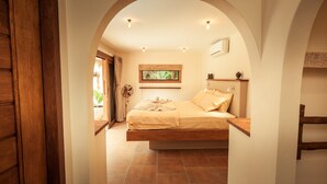 A bedroom with a bed, a ceiling fan, a window with a view, and a door leading to an outdoor area. - 2 Private Tropical villas, 10 bedrooms, Event & Yoga space,  for + 20 guests! (koh pha ngan)