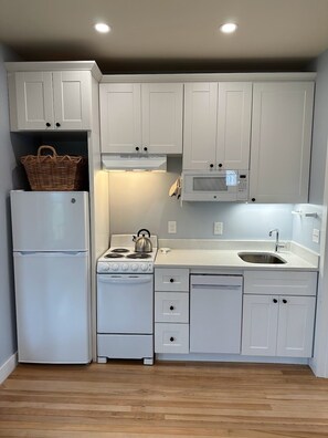 Fridge, microwave, stovetop, coffee/tea maker