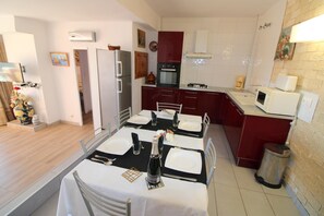 Microwave, coffee/tea maker, toaster, cookware/dishes/utensils
