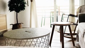 A room with a round table, a chair, a bed, and a potted plant. - Cozy and comfortable, best location! Ideal for families. (Costa Adeje)
