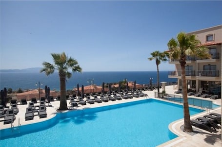 Seasonal outdoor pool, open 8:00 AM to 10:30 PM, sun loungers