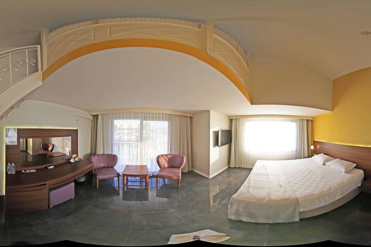 Family Room, Partial Sea View | Premium bedding, minibar, in-room safe, desk