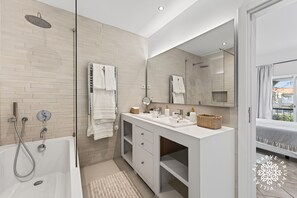 Bathtub, hair dryer, towels