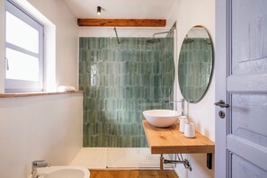 Bathtub, bidet, towels, soap