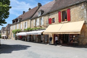 A stone building with a café and souvenir shop on the ground floor.