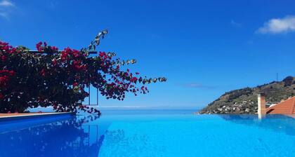 Villa with infinity pool and games room overlooking the sea