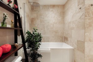 Combined shower/tub, hair dryer, towels, soap