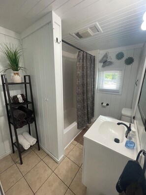 Combined shower/tub, hair dryer, towels, soap
