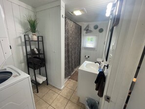 Combined shower/bathtub, hair dryer, towels, soap