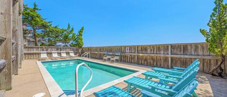 Dive into your private oasis—a sparkling pool surrounded by sun-warmed loungers, where you can soak up the coastal breeze and unwind under bright blue skies.