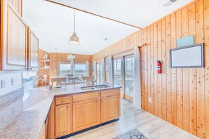 Enjoy a kitchen with a central island and large window offering a view of the surrounding landscape.