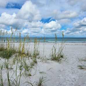 On the beach, sun loungers, beach towels