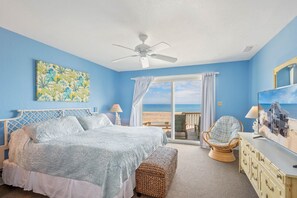 A bedroom with a bed, a chair, a dresser, and a view of the ocean. - Oceanfront Dog Friendly w/ Hot Tub, Theater, Community Pool & Tennis/Pickleball (Avon)