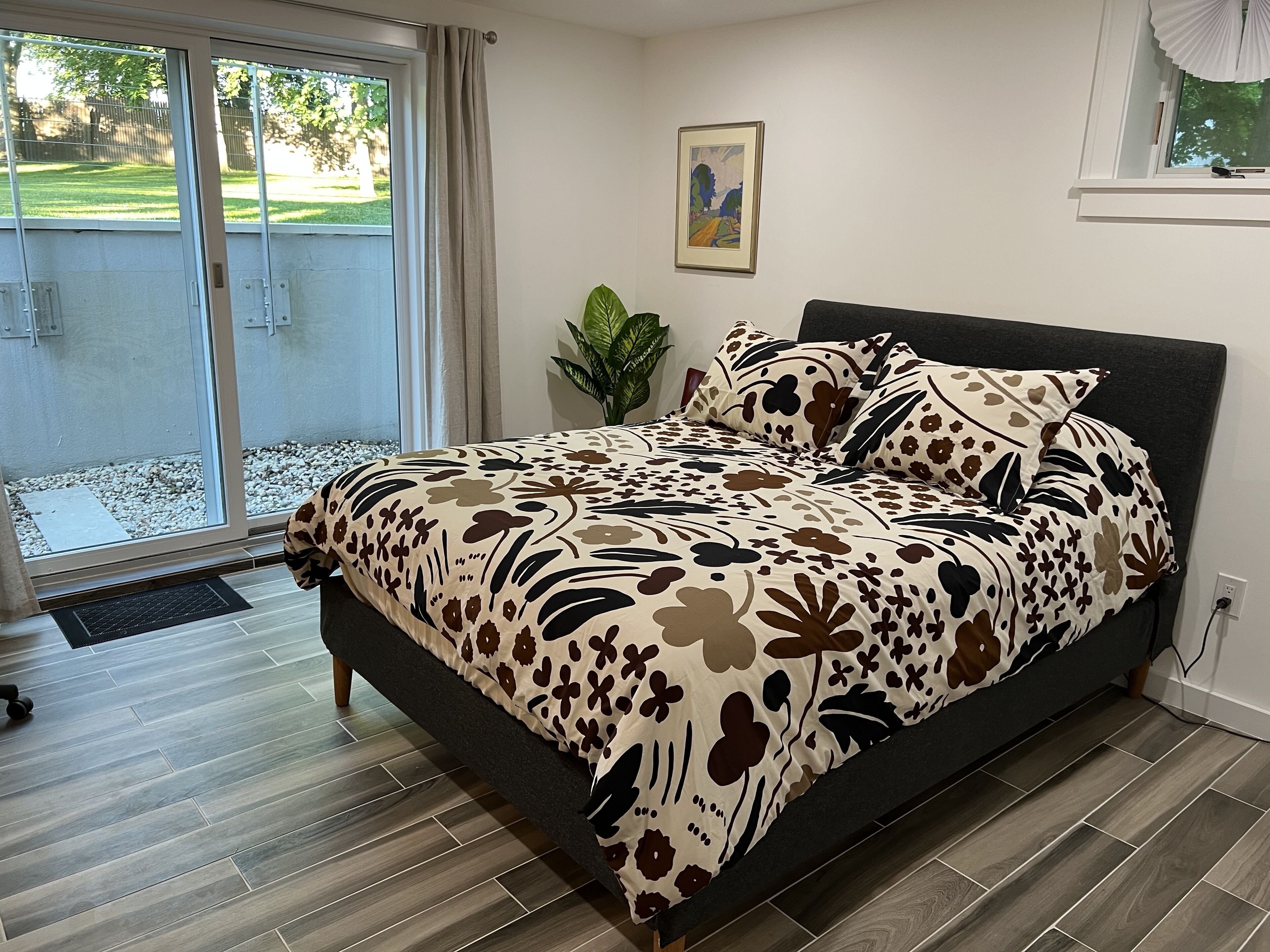 Lower level bedroom with sliding door