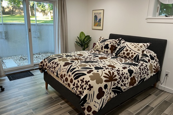 Lower level bedroom with sliding door