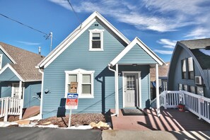 A blue house with a white door and window, a porch, and a no smoking sign. - Bubba's Blue Bungalow WALK to Lifts and Main St (Park City)