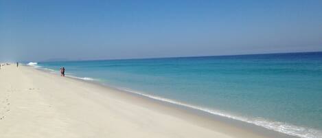 On the beach, sun-loungers