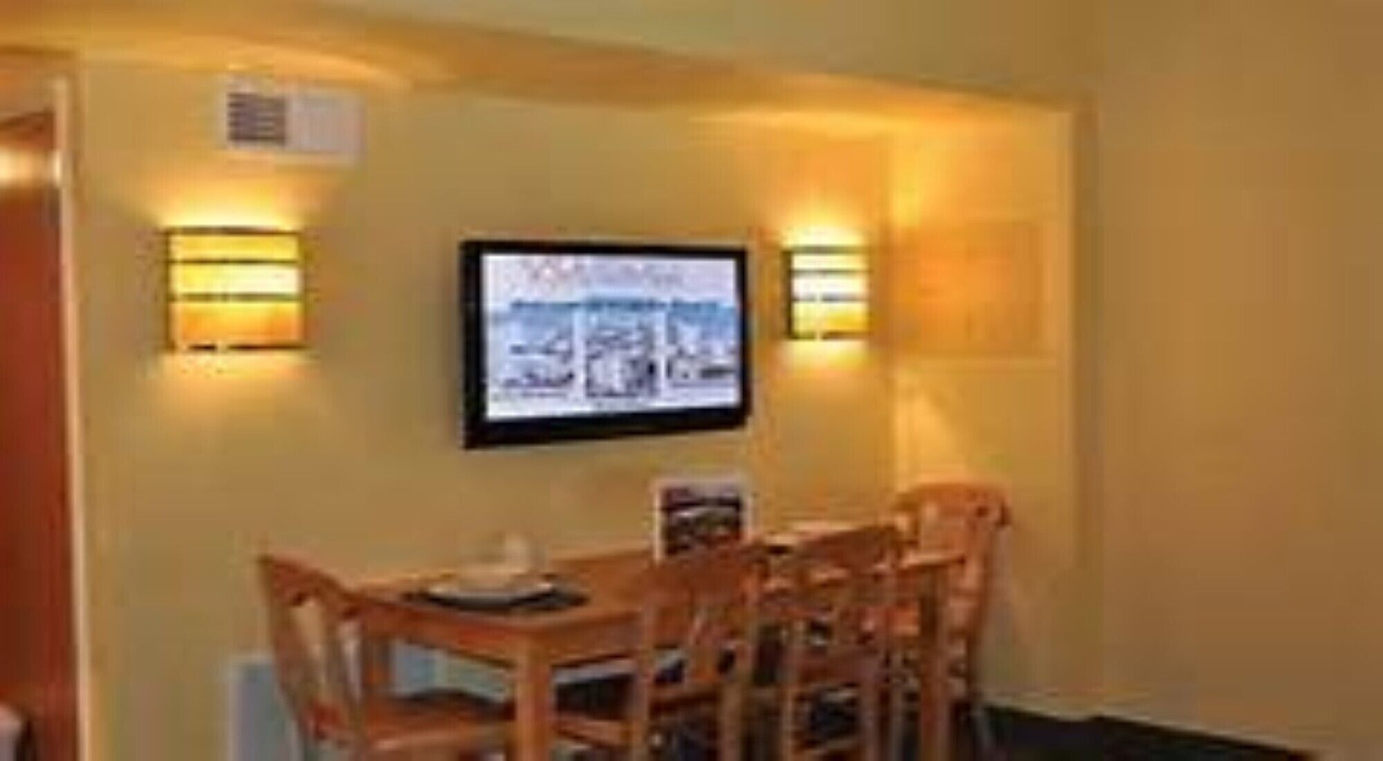 dining room table with a big flat screen