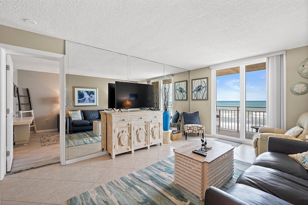 Living room with sliders to Balcony overlooking beach/ocean