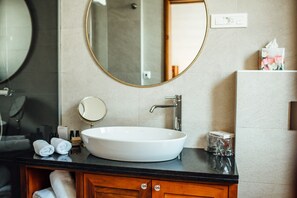 Shower, hair dryer, towels, shampoo