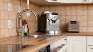 A kitchen with a stainless steel sink, a coffee machine, and a toaster. - Feel yourself at  Three Bears appartment :) (Kotka)