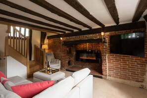 Smart TV, fireplace, books