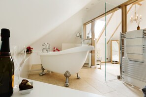 Bathtub, hair dryer, towels, soap