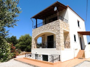 A two-story house with a stone facade, a balcony, and a satellite dish. - A Recently Refurbed 3 Bedrm Villa, Large Pool, Great Privacy, Close to Amenities (Chania)