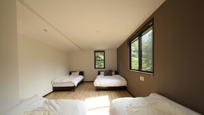 A bedroom with two beds, a window, and a wooden floor. - RiverStone MinakamiCampsite (Minakami)