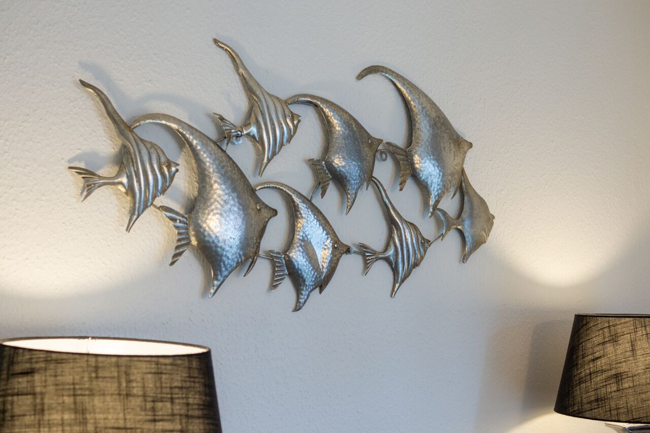 A wall-mounted decorative piece of fish.