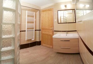 Bathtub, hair dryer, towels, soap